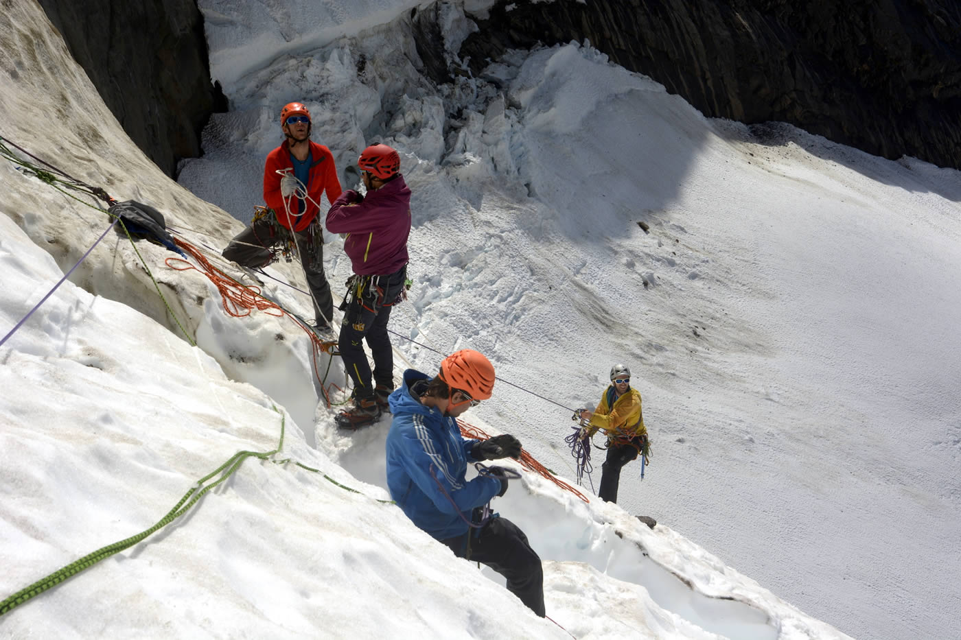 Access to the team's chosen line was barred by a 100-meter overhanging serac. With four ice screws, this proved to be a very intense moment for the group. Left to right are Jerome Sullivan, Fabio Lupo, Christian Ledergerber and Antoine Moineville. [Photo] Silvan Schuepbach