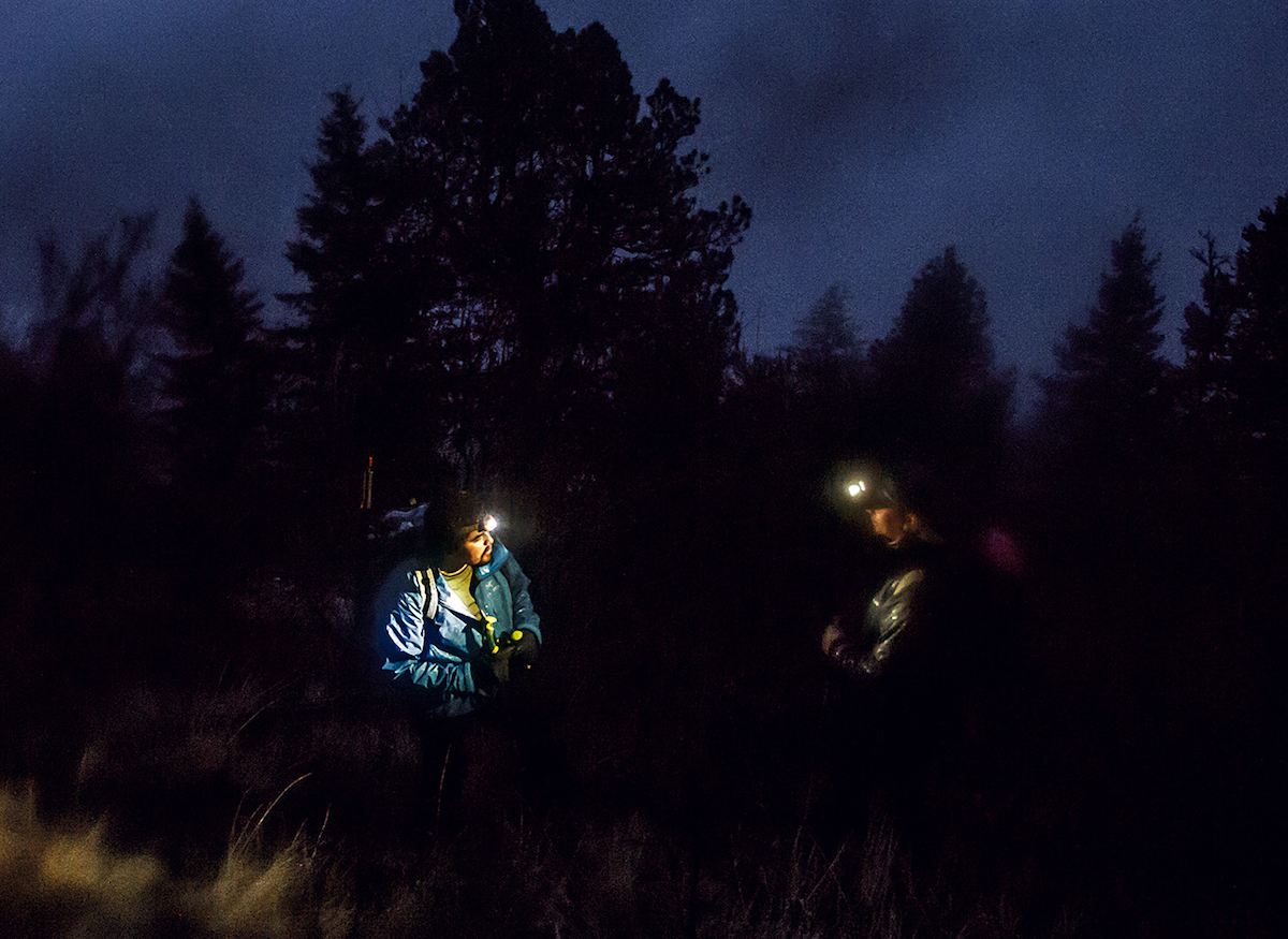 Necefer and Moses-Conner in deep discussion as darkness falls on Doug Peak. [Photo] Joe Whittle