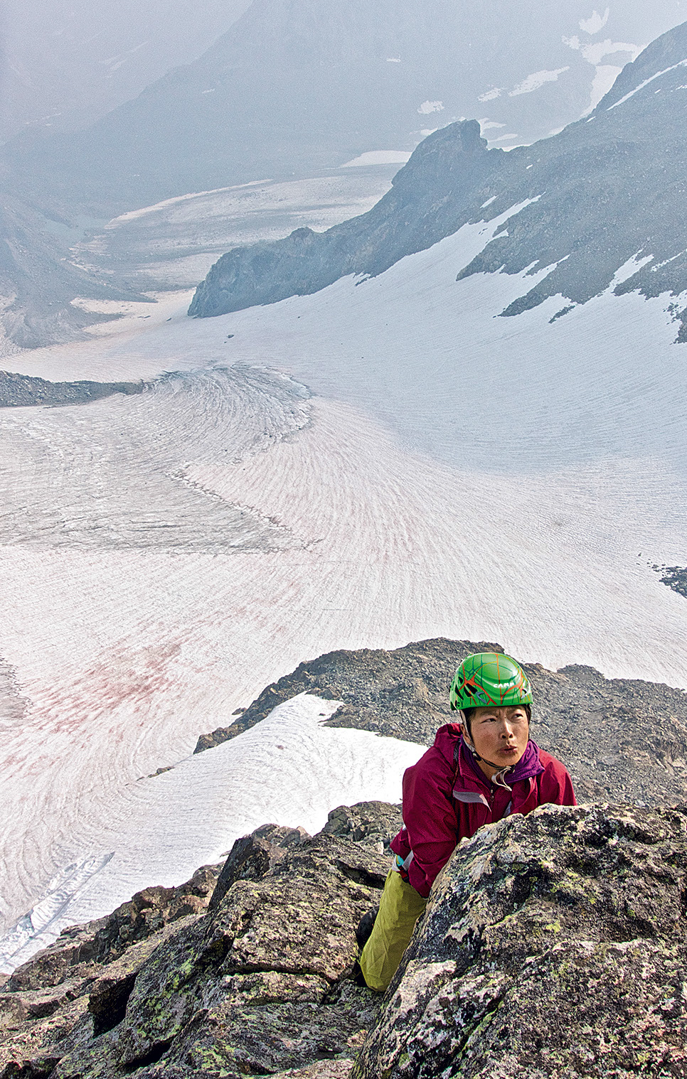 Yi on the east face of the Sphinx (13,258'). [Photo] Dave Anderson