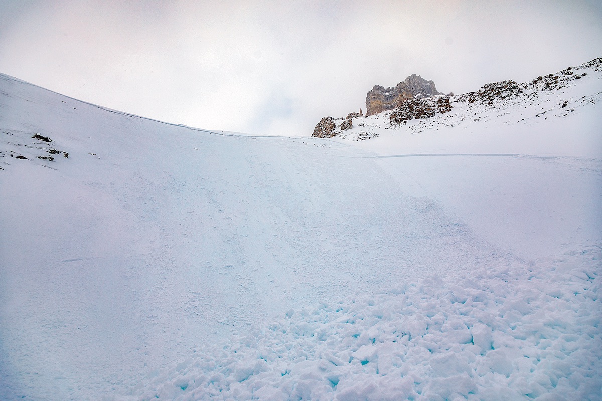 The foot-tall crown line that measured as wide as the length of two football fields delineates where the avalanche broke free on Sentinel Pass and entrenched Tim Banfield, Schumacher and Kadatz. According to Parks Canada Visitor Safety, the debris became deepest--five meters, in places--where the slope funneled and its angle flattened. [Photo] Tim Banfield