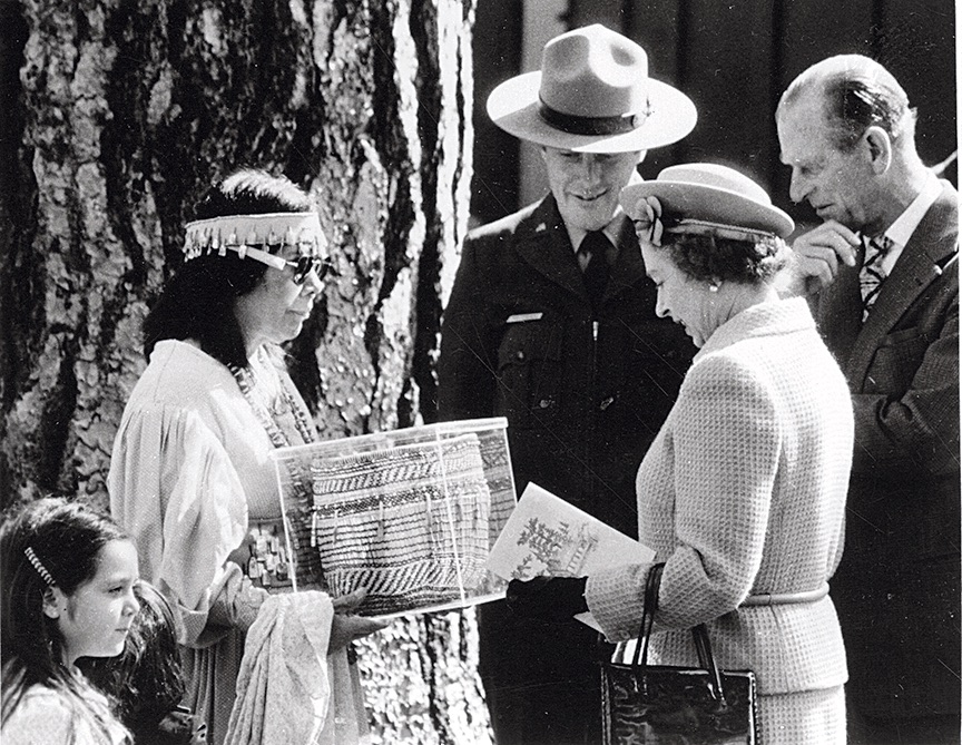 Julia Parker presents a basket she made to Queen Elizabeth II. [Photo] Yosemite Historic Photo Collection