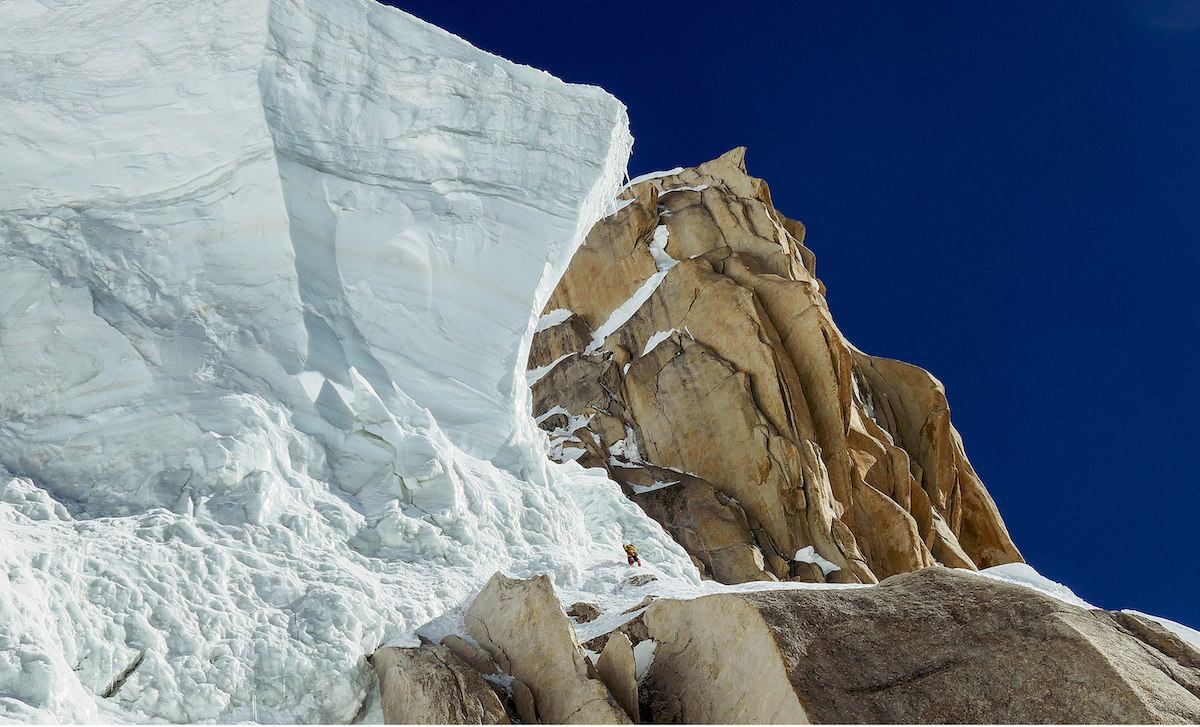 Approximately 1000 meters beneath the summit, Wright leads toward the serac that presented a major obstacle to the team's ascent. They eventually overcame the feature by climbing around and then behind the hanging ice. [Photo] Mark Richey