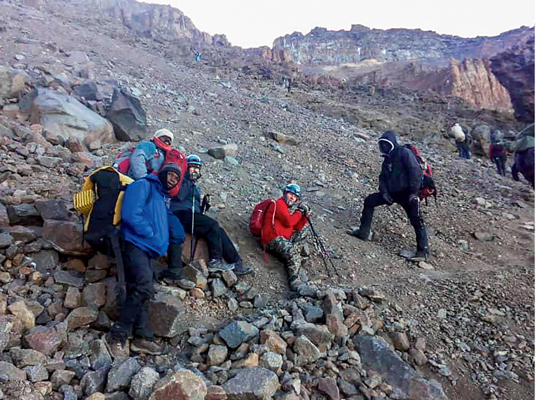 A group of climbers with Barnabas on the way to Crater Camp via the Western Breach route. [Photo] Lukiano Barnabas