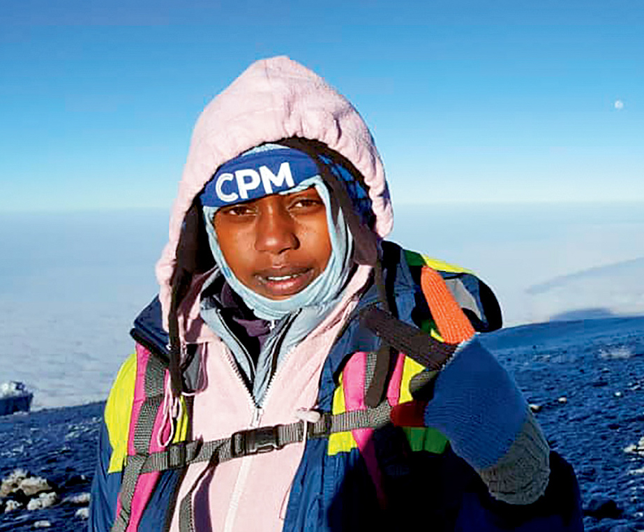 Asifiwe Makere at sunrise near the summit of Kilimanjaro. Glory Thobias Salema launched the TWGF in 2015, she says, to empower women to become guides. [Photo] Asifiwe Makere
