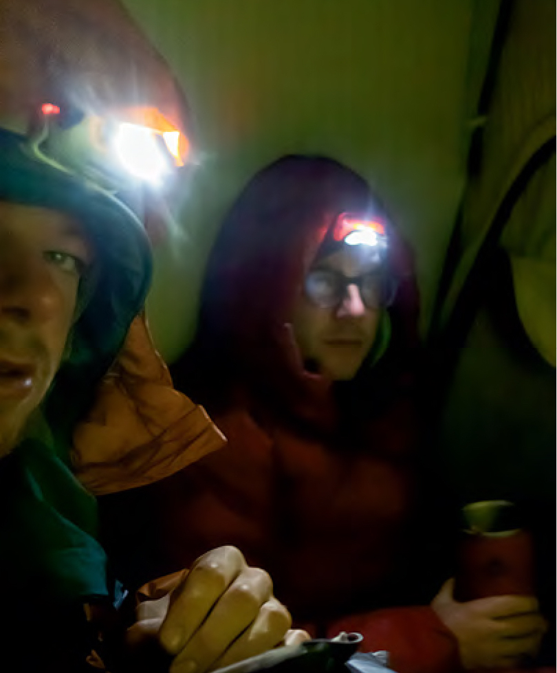 Hawthorn (left) and Berman on the morning of their summit bivy, consuming instant noodles for breakfast. [Photo] Uisdean Hawthorn