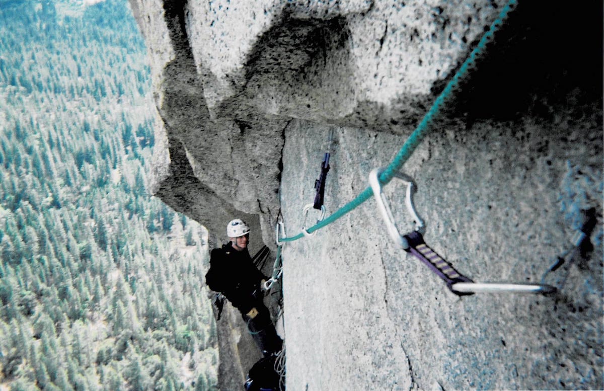 Derek Franz belays on Ten Days After (5.7 A2+, 12 pitches), Washington Column, 2004. During this climb, he had his first experience of sleeping in a portaledge. [Photo] Todd Preston, Derek Franz collection