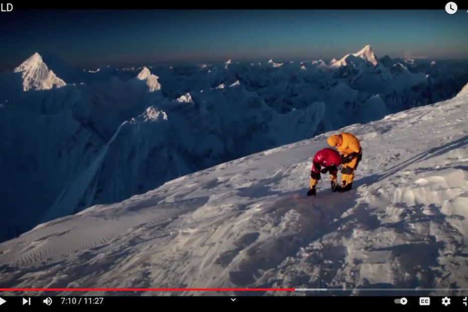 This screenshot from the 2011 film Cold shows the team of Cory Richards, Simone Moro and Denis Urubko near the summit of Gasherbrum II (8034m) during the first winter ascent of the peak. Image used with permission from film director Anson Fogel.
