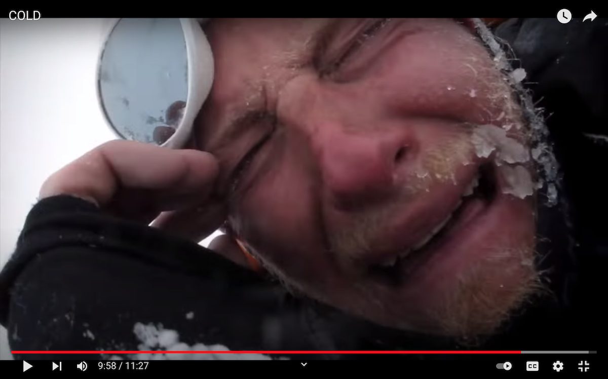 This screenshot from the 2011 film Cold shows Cory Richards turning the camera on himself after being caught in an avalanche. Image used with permission from film director Anson Fogel.