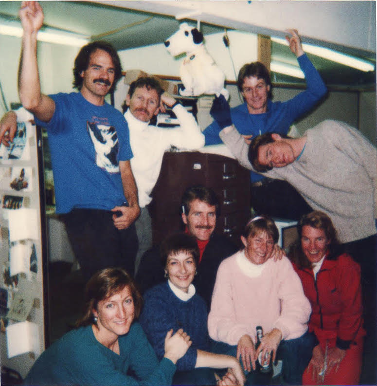 Climbing magazine office, in the back of the Aspen Times building, 1986. Top, left to right: Jonathan Waterman, Michael Kennedy, Mike Benge. Bottom, left to right: Alison Osius, Penny Ellis (business manager), Mark Thomas (circulation manager), Lynn Thomas (office manager), Julie Kennedy. Leaning over: Will Gadd (intern). [Photo] Michael Kennedy collection