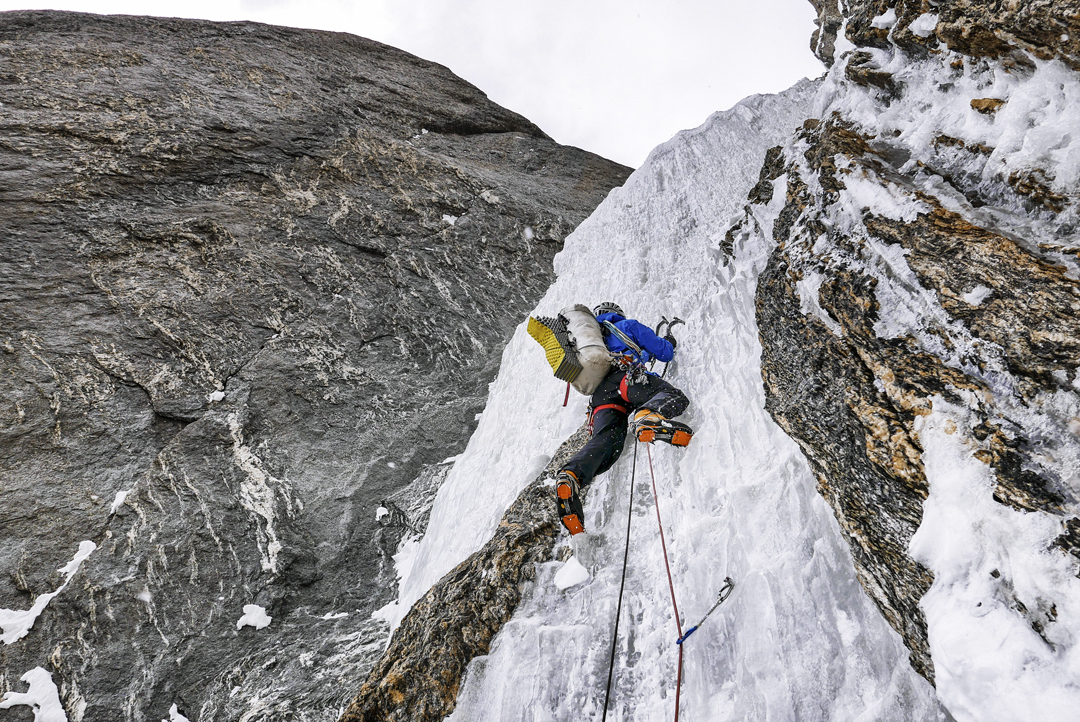 Novak starting the fourth steep pitch on the second day of All or Nothing. Above this the team entered the upper couloir, where they were forced to climb and search for a bivouac spot until midnight. [Photo] Marko Prezelj