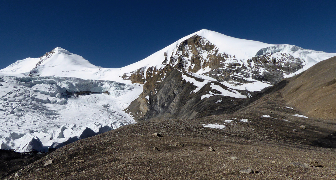 Purkung and an unnamed 6,000m peak to its left (southeast). The 2017 route of ascent on Purkung more or less followed the right skyline.  [Photo] Paulo Grobel