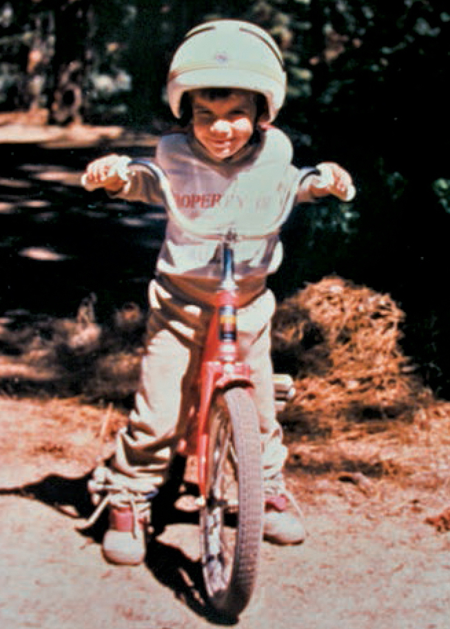 Honnold at Lake Tahoe, California, during his third summer. His mother says, Alex rode a 2-wheeler from the age of about 2 and a half--which scared the bejeebers out of all the moms in our court. [Photo] Courtesy Dierdre Wolownick