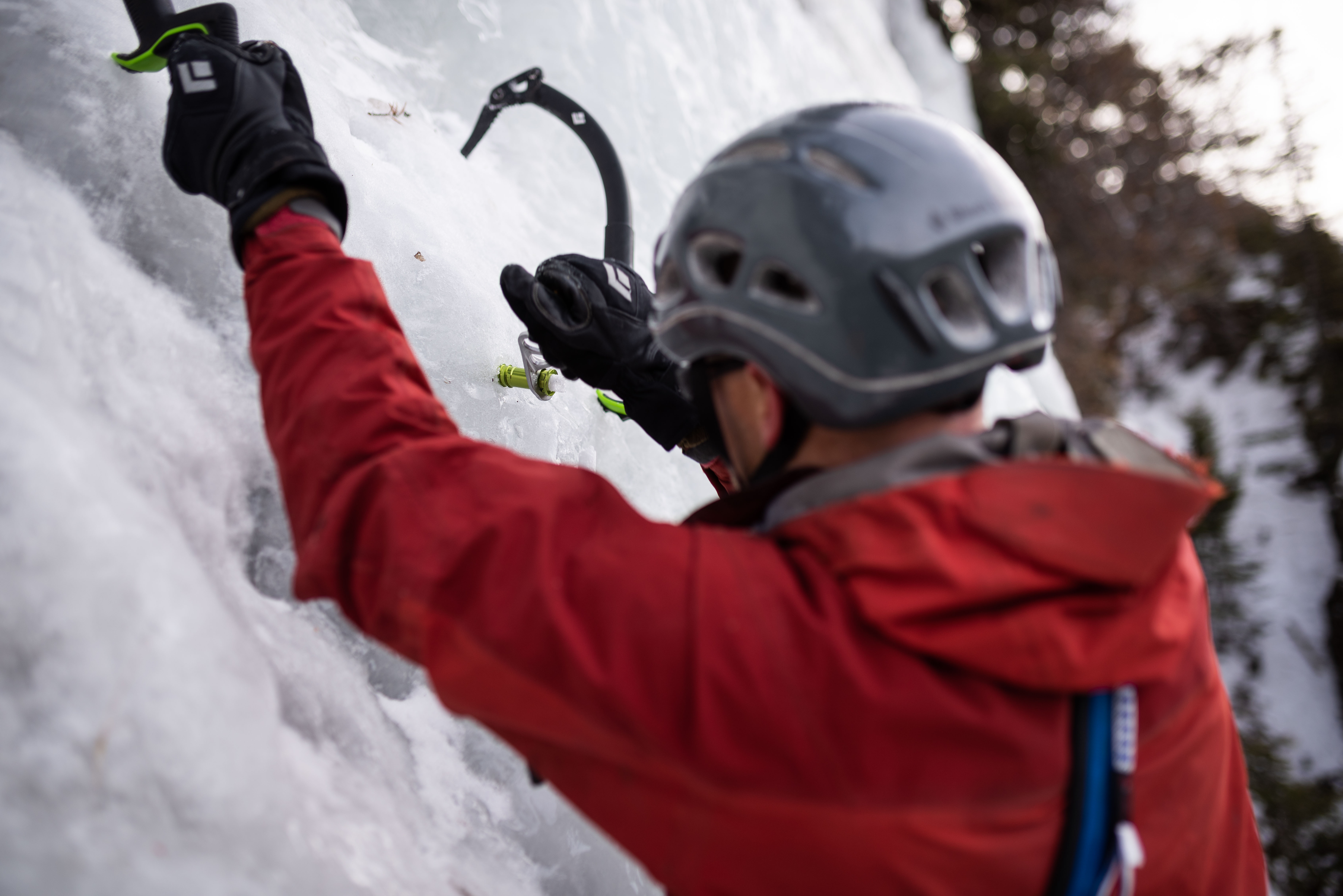 The author places a Black Diamond Ultralight Express screw in Hyalite Canyon, Montana. [Photo] Jim Menkol
