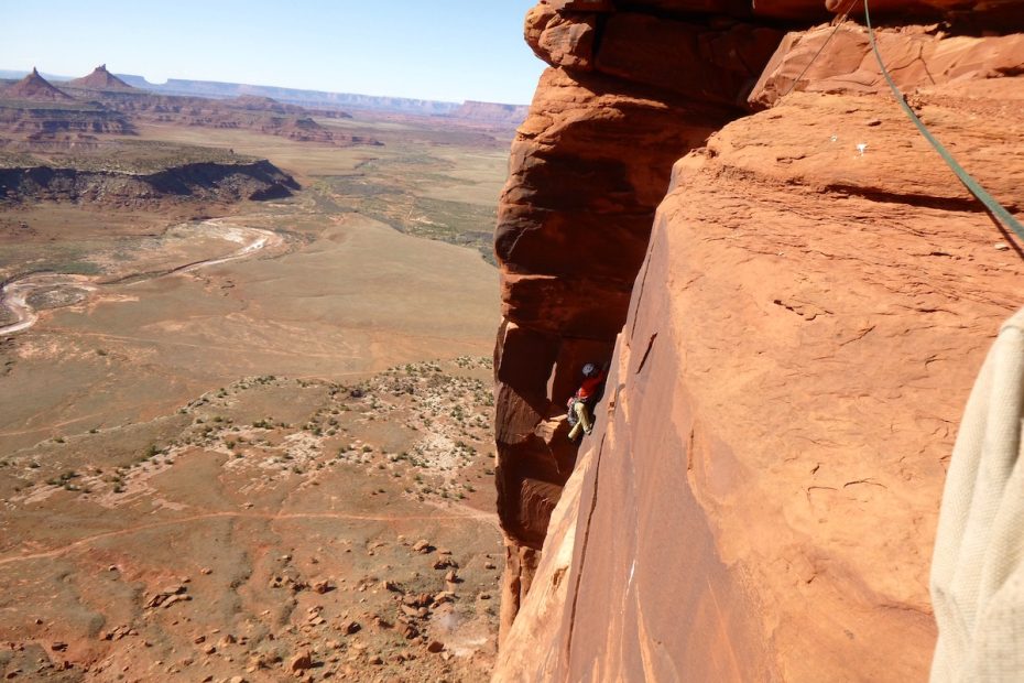 A climber nears the top of Rim Shot (5.11-, 400'), Bridger Jack Butte, Indian Creek, Utah. The area is included in the new Bears Ears National Monument, which Utah lawmakers are asking President Donald Trump to rescind. [Photo] Derek Franz