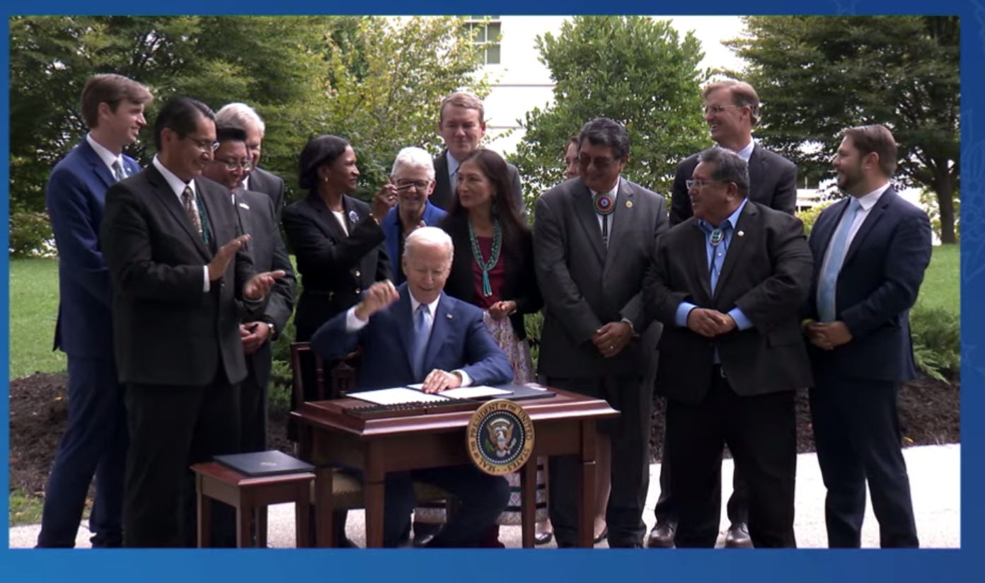 A screenshot from the livestreamed event outside the White House on October 8 as President Joe Biden signed the proclamations restoring the protections to Bears Ears, Grand Staircase-Escalante and Northeast Canyons and Seamounts Marine national monuments as set by President Barack Obama. Biden handed out the pens he used to the people gathered behind him. [Photo] Derek Franz