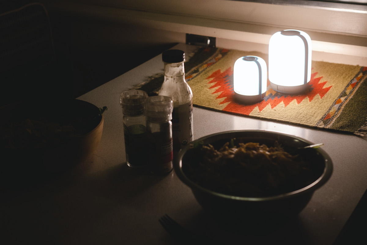 The AlpenGlow 250 and 500 lanterns provide light for dinner in the author's camper. [Photo] Miya Tsudome