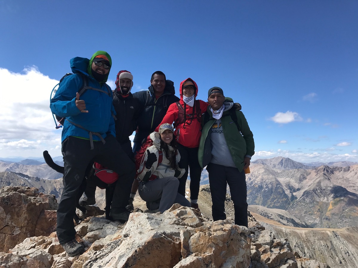 Len Necefer, left, poses on a summit with other members of Natives Outdoors. [Photo] Len Necefer
