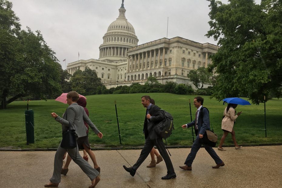 The delegation of Colorado climbers walks through the rain from the House to the Senate while lobbying Congress in Washington, DC, on May 11 as part of the Climb the Hill event organized by the Access Fund and American Alpine Club. [Photo] Derek Franz