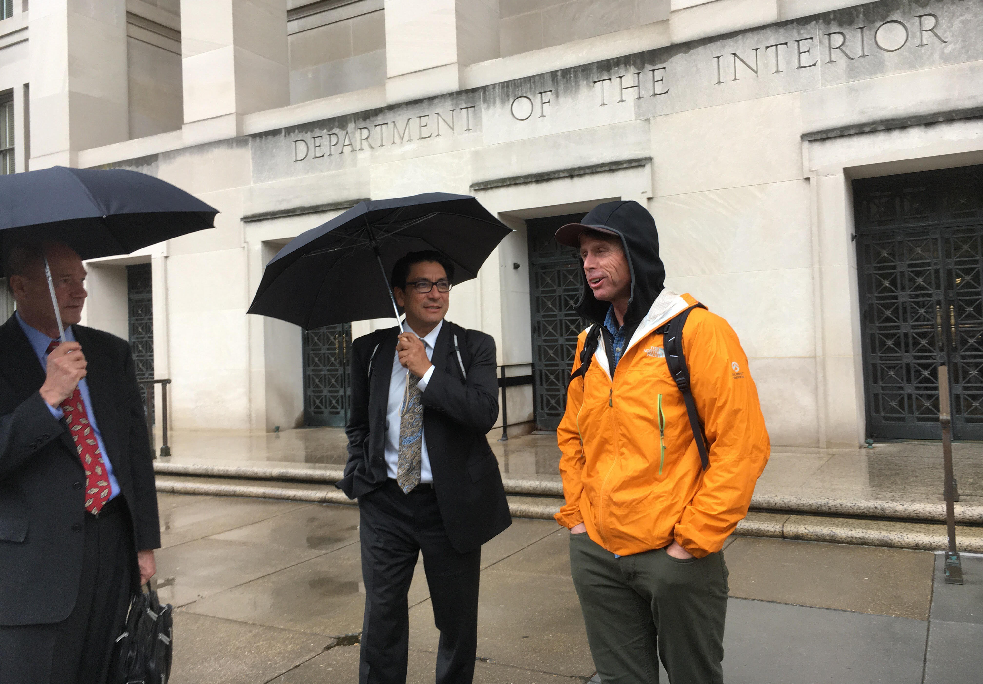 From left, Access Fund representatives Curt Shannon, Kenji Haroutunian and Peter Croft wait for a cab after meetings inside the Department of Interior. [Photo] Derek Franz
