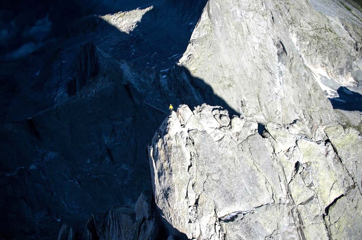 Arnold stands atop Switzerland's Piz Badile (3308m) after free soloing the Via Cassin (6a or 5.10a 800m) in 52 minutes. [Photo] Dani Arnold collection