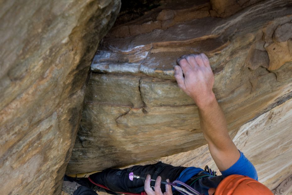 Chris Kalman placing a #6 (purple) DMM Dragonfly on a steep new route in Arizona. [Photo] Nelson Klein