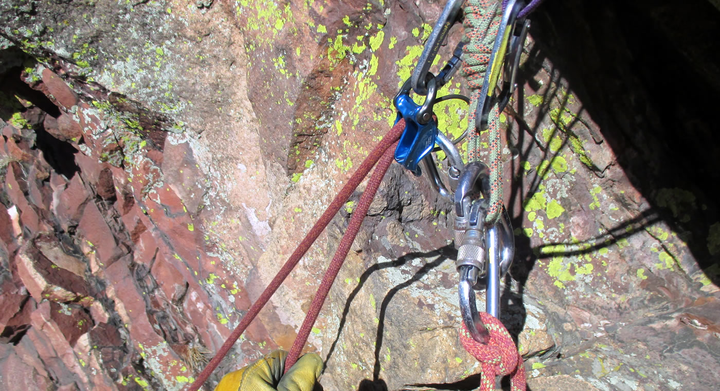 The DMM Pivot is an assisted-braking belay device that works well for top-belaying a climber directly from the anchor, as shown here. [Photo] Peter Braam