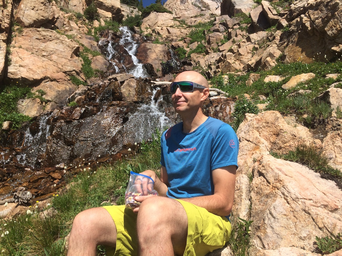 The author takes a snack break off trail in the Indian Peaks Wilderness, Colorado, while wearing the Dragon Alliance Flash LL Ions. [Photo] Catherine Houston