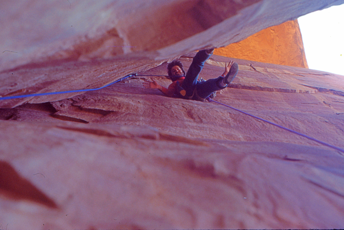 Webster leading on the first ascent of Poseidon Adventure (5.10 R) on Lighthouse Tower, Utah, 1984. [Photo] Jeff Achey