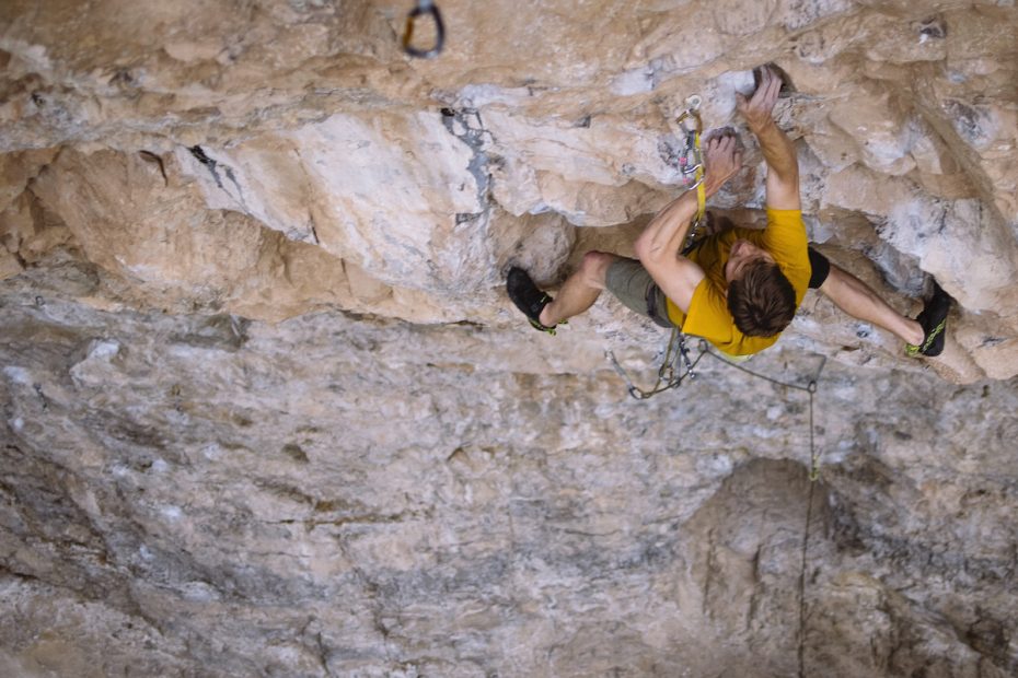 Derek Franz on Magnetar (5.13d), Rifle Mountain Park, Colorado. The Edelrid Bulletproof quickdraw is the first one clipped to the rope above the ground, near the lower right corner of the frame. The carabiner that the Bulletproof draw replaced was severely grooved. [Photo] Karissa Frye