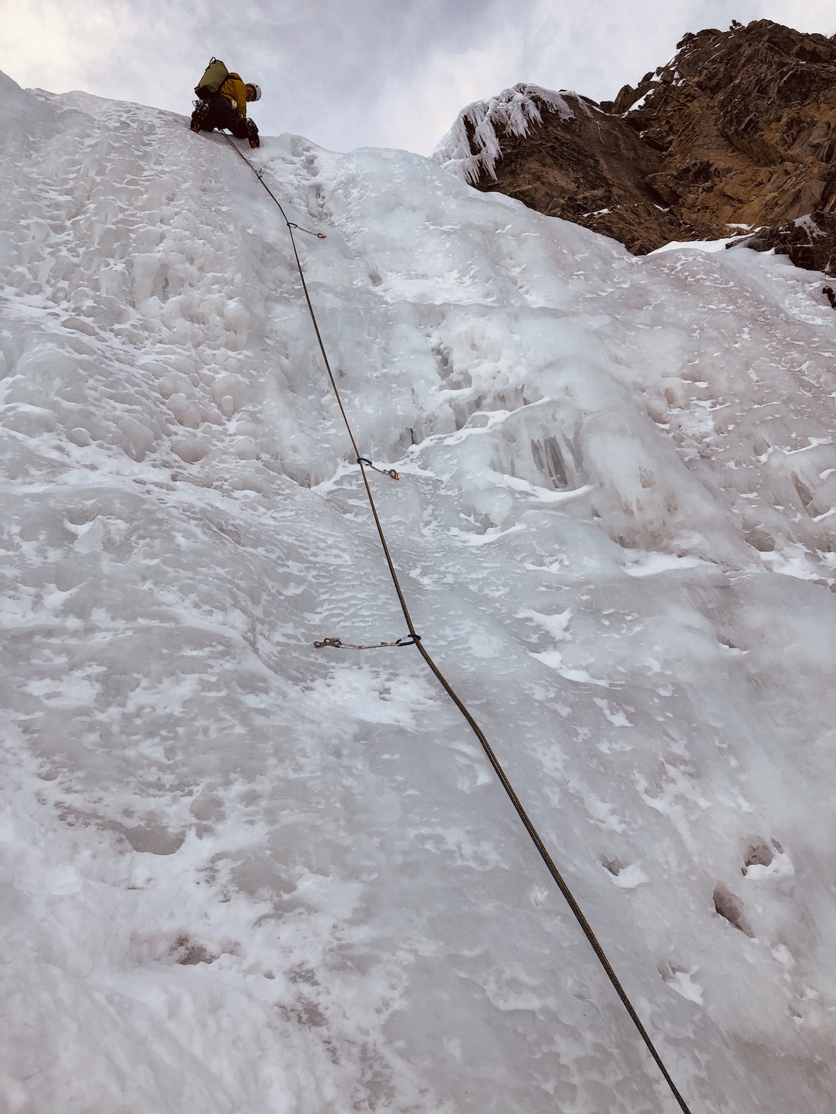 Cold, wet conditions with dry snow on the belay ledges made for tricky conditions—but Bruno Schull makes it look easy above Sertig, Switzerland. [Photo] Rob Coppolillo