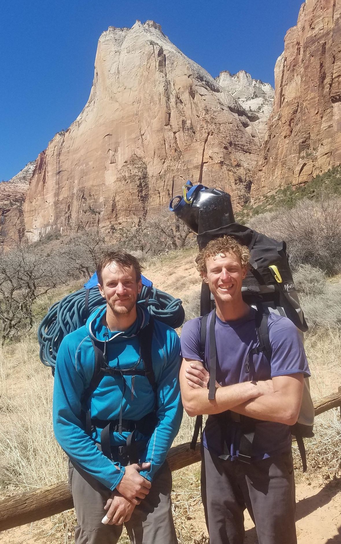 Brandon Adams, left, and Roger Putnam in Zion after the first ascent of Pangea (VI 5.10 A4) on Abraham (visible in the background), March 2018. [Photo] Roger Putnam collection