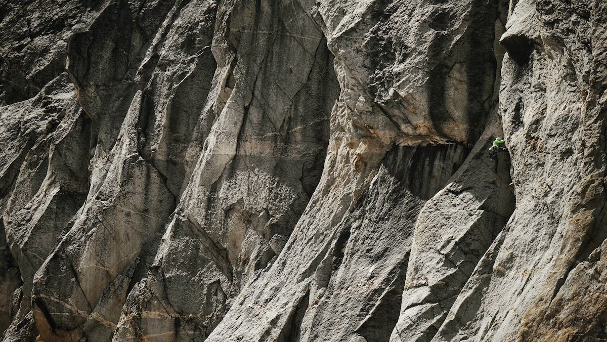 Morris climbs through the sea of granite on the East face of Hall Peak (9,975') during the first ascent of Heart Like A Hippo (5.10b, 800'). [Photo] Graham Zimmerman