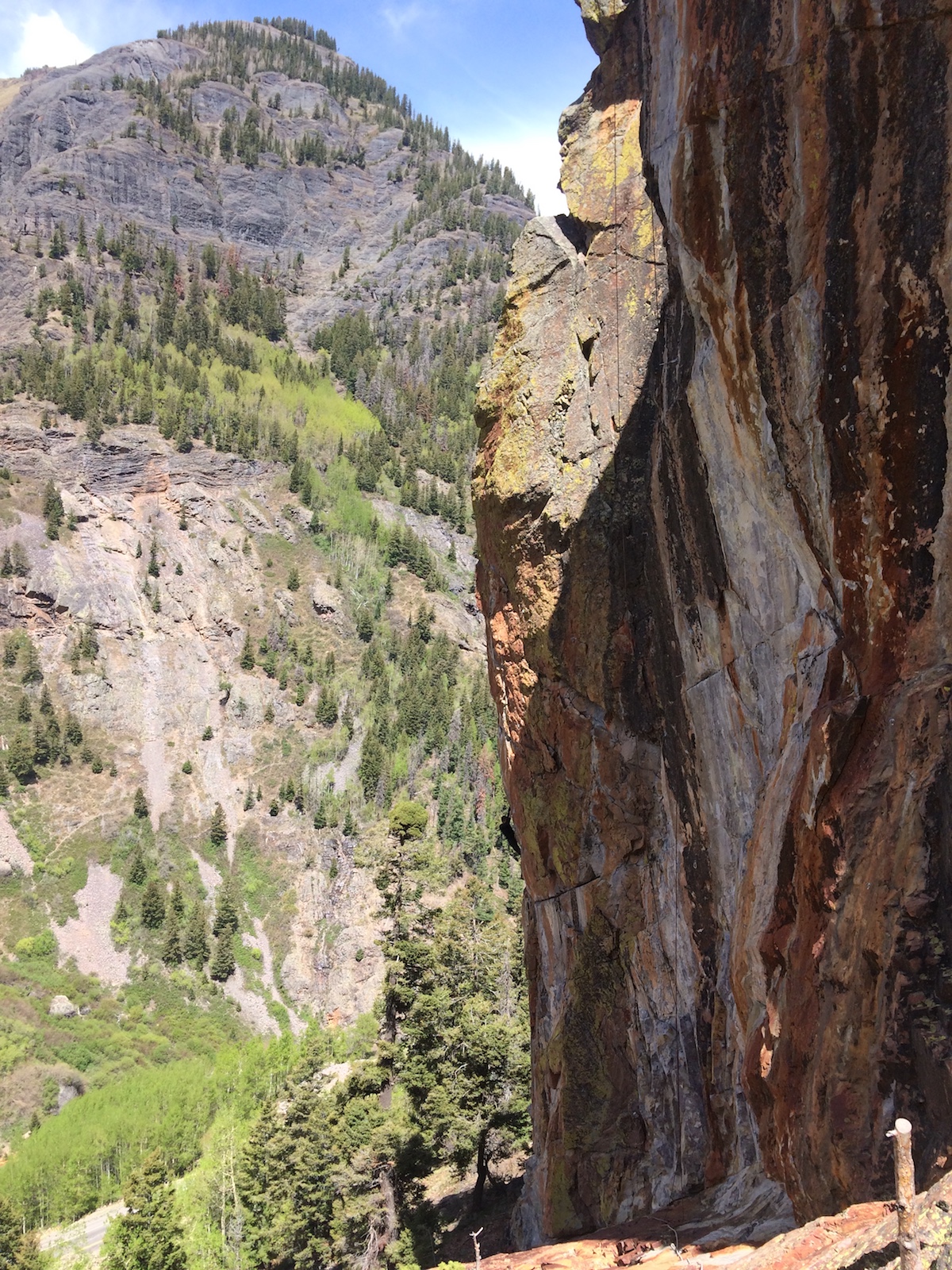 The Foehn Brise Pants were ideal for the chilly spring temps at the Techno Crag (ca. 9,000') above Ouray, Colorado, last May. Here the author enjoys the classic arete of All Night Rave (5.12b) with numb fingers. [Photo] Mandi Franz