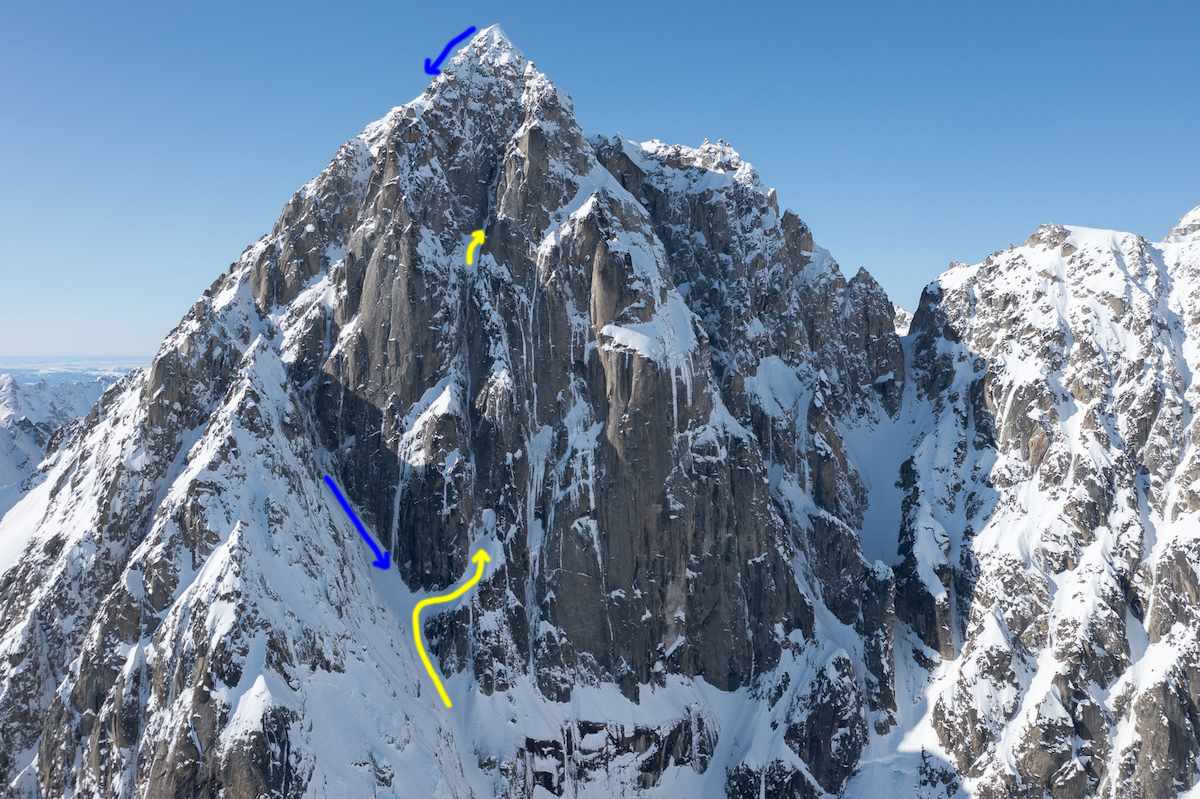 The east face of Golgotha: The yellow arrows show Shaft of the Abyss and the blue arrows show the line of descent by which the peak was originally climbed in 2012. [Photo] Courtesy of Clint Helander, illustration by Derek Franz