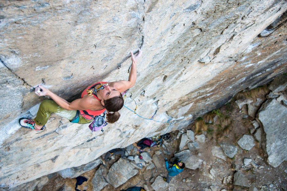 Barbara Zangerl carries a cam in her mouth to save energy for placing it during her greenpoint bid of Switzerland's Gondo Crack (5.14b R). The route was bolted 15 years ago and remained unclimbed until the end of March when Zangerl and her partner, Jacopo Larcher, did the first ascents using the bolts. In early April the two then sent the route using removable protection, skipping the bolts and risking huge falls from the crux. [Photo] Richard Felderer