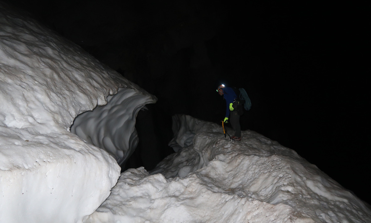 Mark Jenkins staring into the bergschrund below the start of route at 4:45a.m. [Photo] Justin Bowen