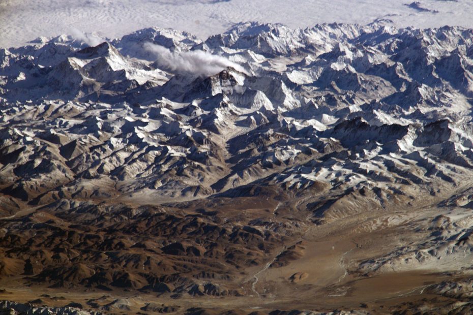 This photograph of the Himalaya was taken from the International Space Station in 2004. Visible from left to right are: Makalu, Chomolungma (Everest), Lhotse and Cho Oyu. [Photo] Courtesy of NASA, Wikimedia