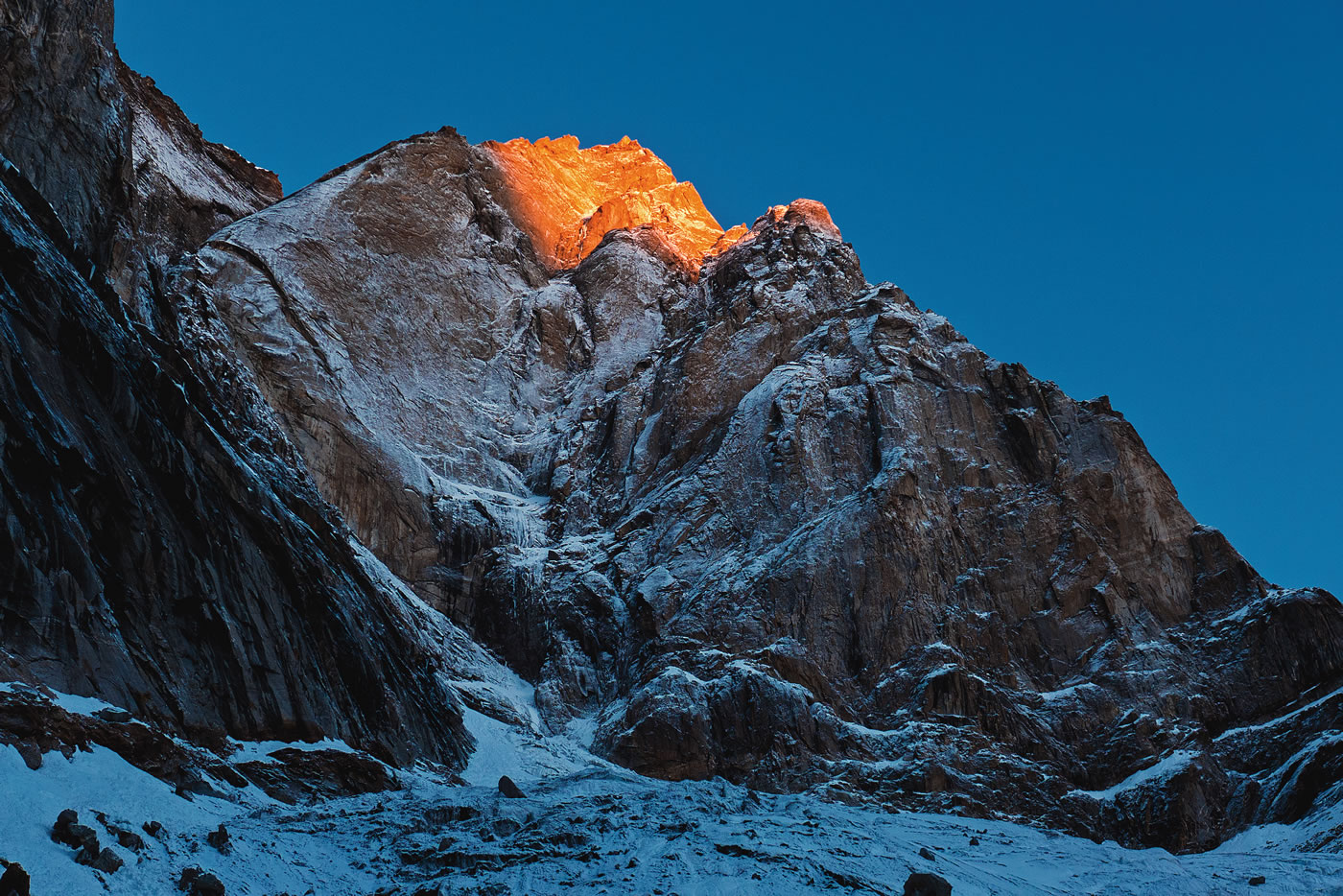 The east face of Cerro Kishtwar gleams in the first morning rays, Day 1. [Photo] Urban Novak