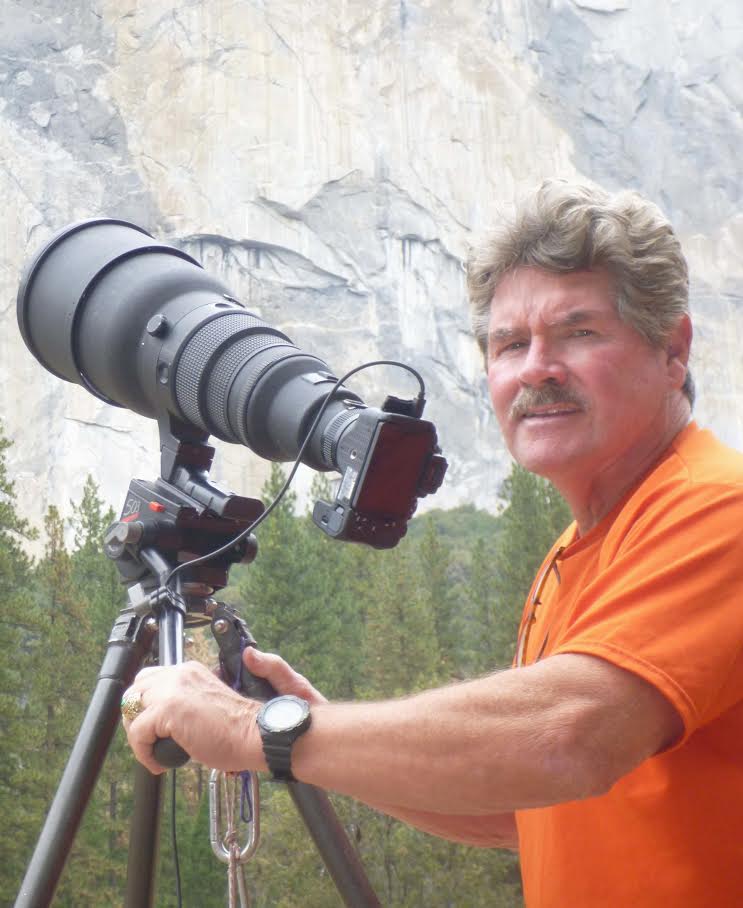 Tom Evans below El Capitan with his telescope-mounted camera. [Photo] Earl Bates