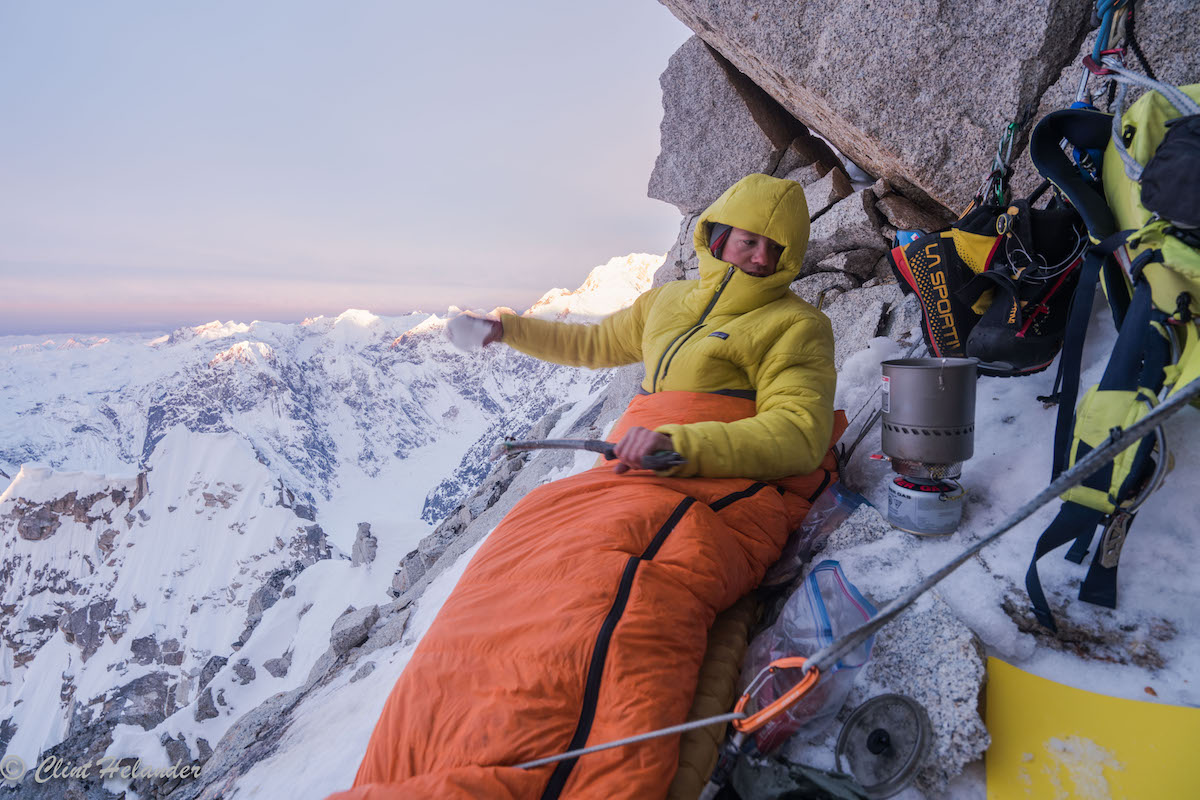 Roskelley settles in for a cramped bivy on Idiot Peak the night before summiting Huntington's South Ridge. [Photo] Clint Helander