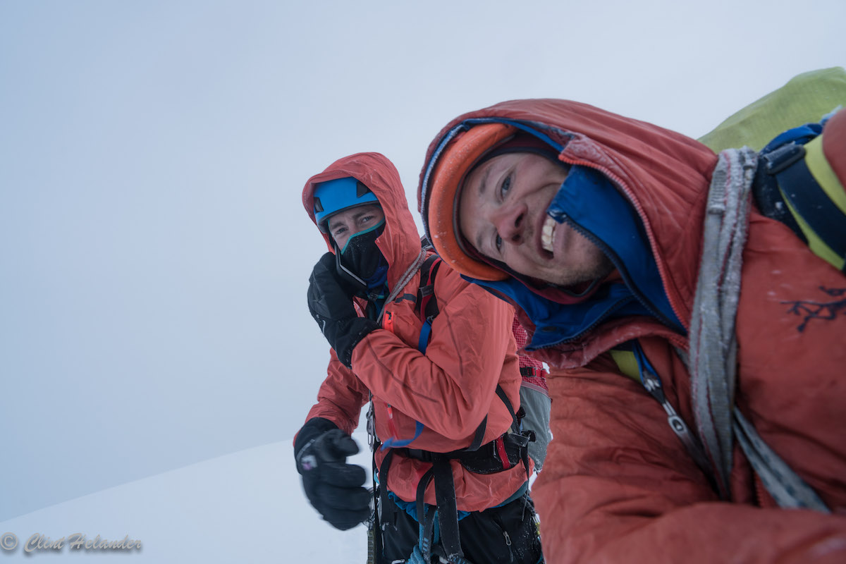 Roskelley and Helander on the summit after completing the five-day first ascent of the Complete South Ridge, which they dubbed Gauntlet Ridge. The two would spend the next 36 hours recovering and waiting for better weather to descend the mountain to base camp. [Photo] Clint Helander