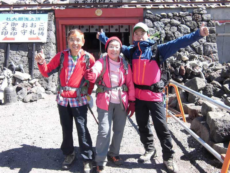 Pictured from left to right are Masanobu, Junko and Shinya Tabei in 2013 on Junko's annual ascent of Mt. Fuji (3776m) with a group of students from Fukushima, Japan. [Photo] Tabei family collection