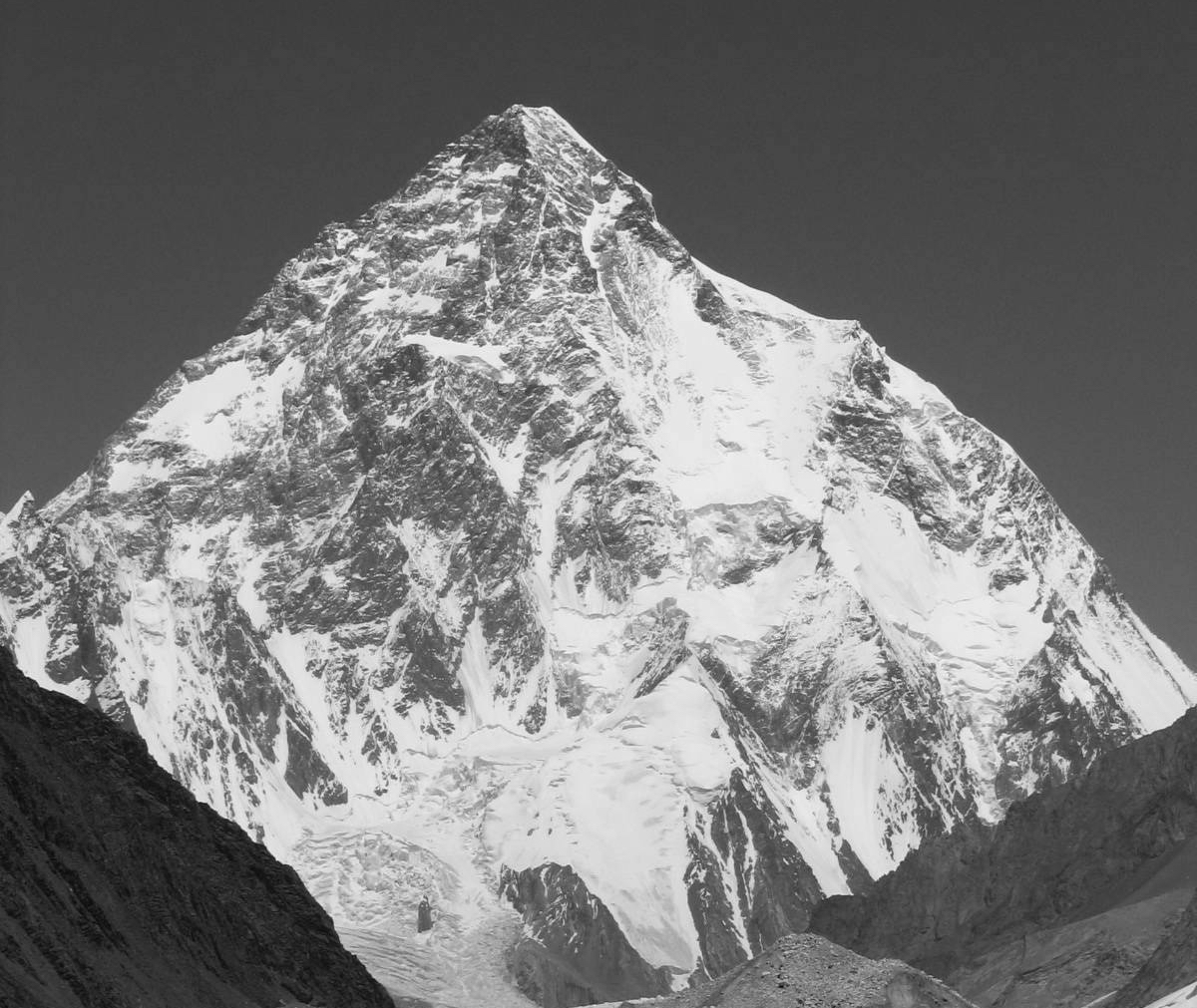 K2 (8611m) is pictured here in summer. The Abruzzi Spur—the route used by all the expeditions this winter—follows the right-hand skyline. [Photo] Svy123, Wikimedia Commons