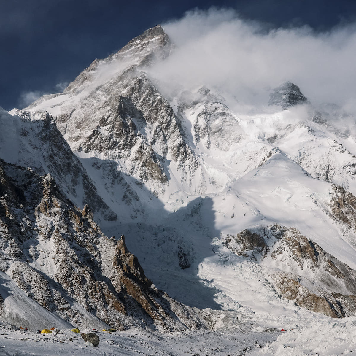 K2 (8611m) looms above base camp on the Godwin Austen Glacier. [Photo] Alex Gavan
