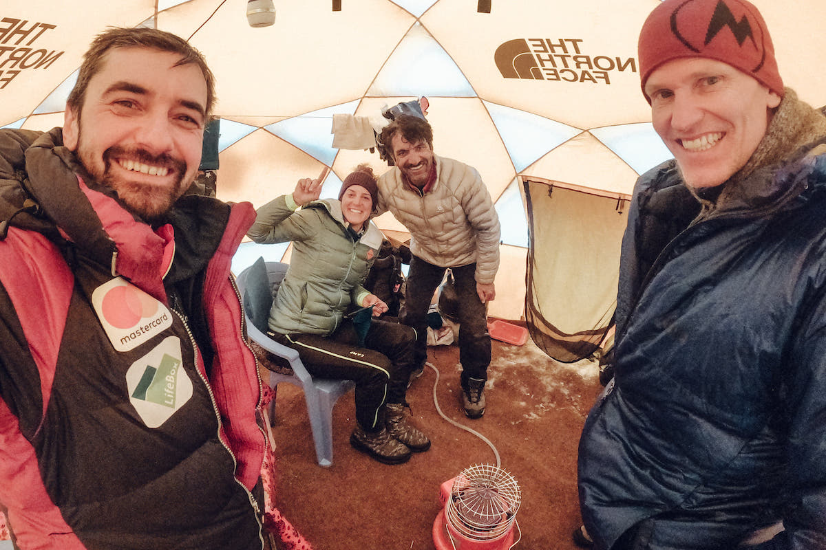 A strategy meeting in the base camp dining tent with friends Muhammad Ali Sadpara (center right) and John Snorri Sigurjonsson (right). [Photo] Alex Gavan