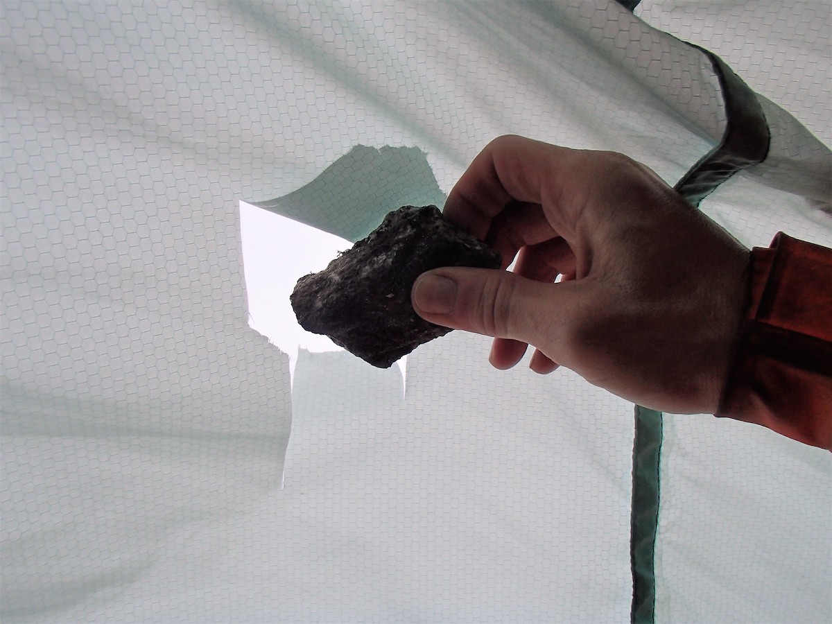 A rock that fell through the portaledge tent fly. [Photo] Marek Raganowicz