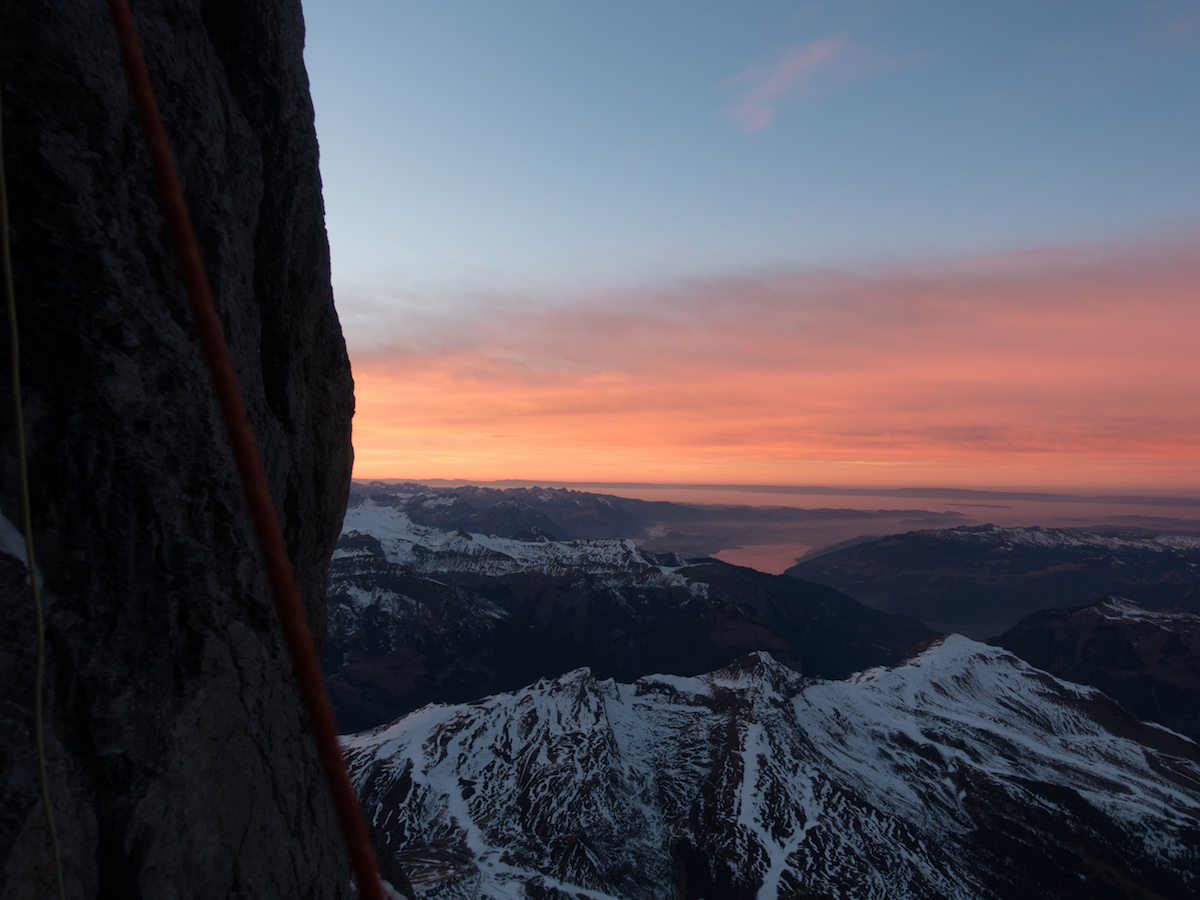 An evening view from the Eiger North Face in the direction of Lake Thun. [Photo] Archive Metanoia