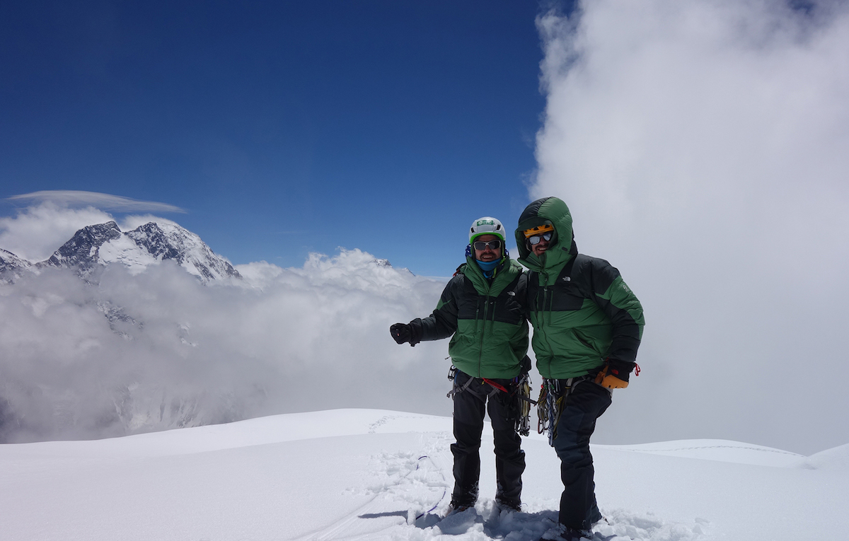 Mora (left) and Bosch stand on the summit of Praqpa Ri South with Broad Peak in the background. They were caught in a storm on the descent and had to spend an extra day at their high camp waiting for conditions to improve. [Photo] Mora/Bosch collection