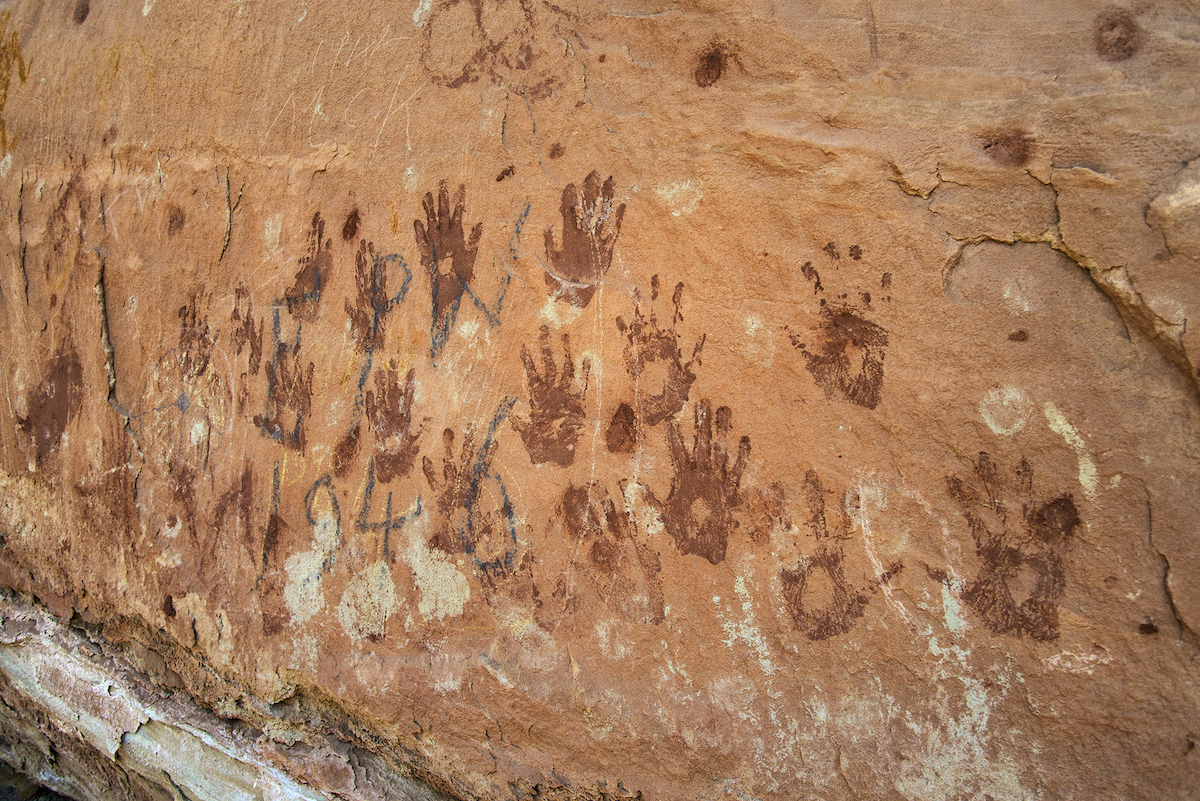Vandalized hand panel on Forest Service land that is no longer included in the former monument. [Photo] Tim Peterson, courtesy of Bears Ears Inter-Tribal Coalition
