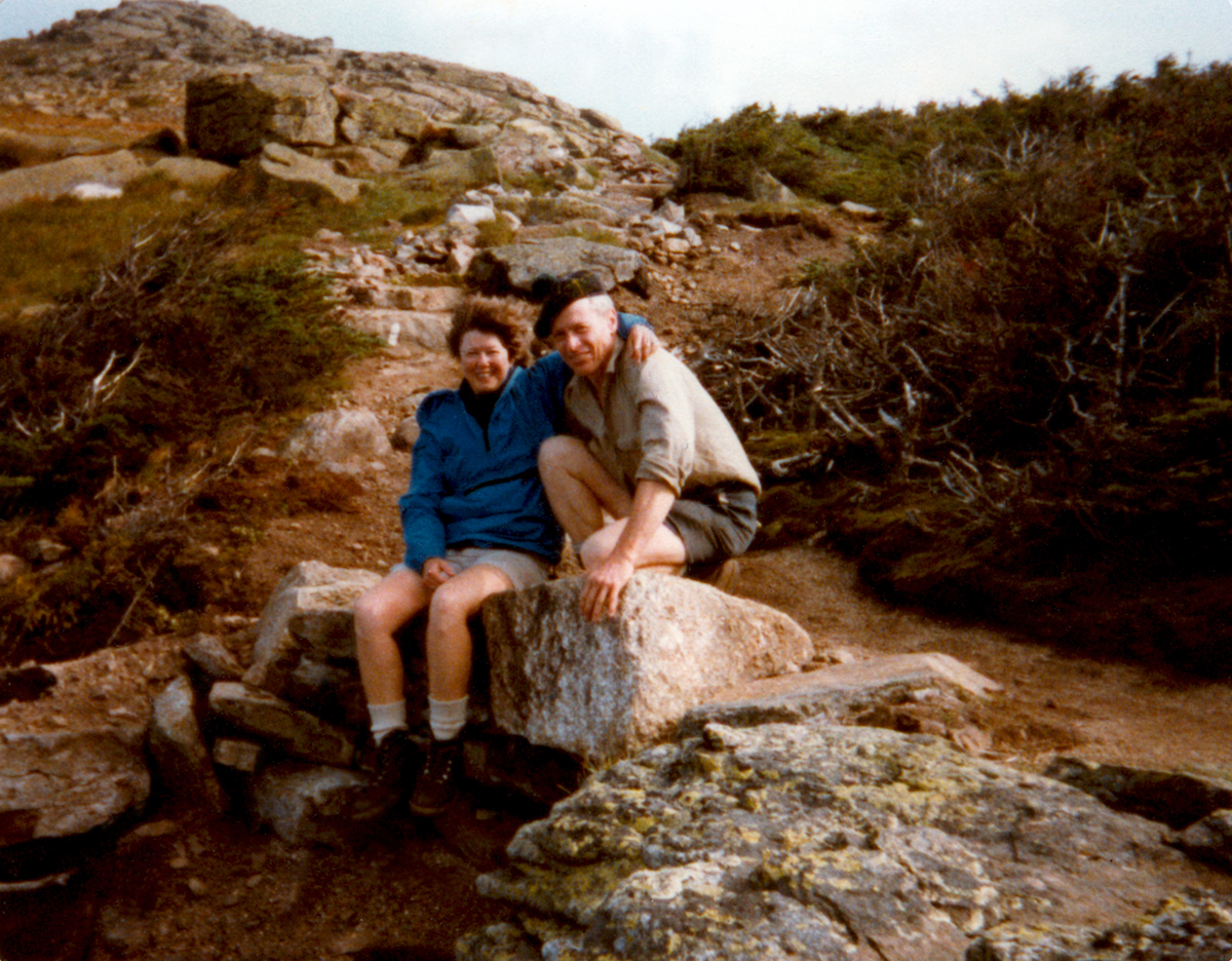 Laura and Guy Waterman are pictured here on the Franconia Ridge in New England's Presidential Range during the mid-1980s, when they were very involved with trail work under the Appalachian Mountain Club's adopt-a-trail program. We and some of our trail work friends had recently placed those rocks at the head of Walker Ravine in an attempt to reinforce the drainage and stabilize the trail, she told Alpinist. [Photo] Waterman family collection